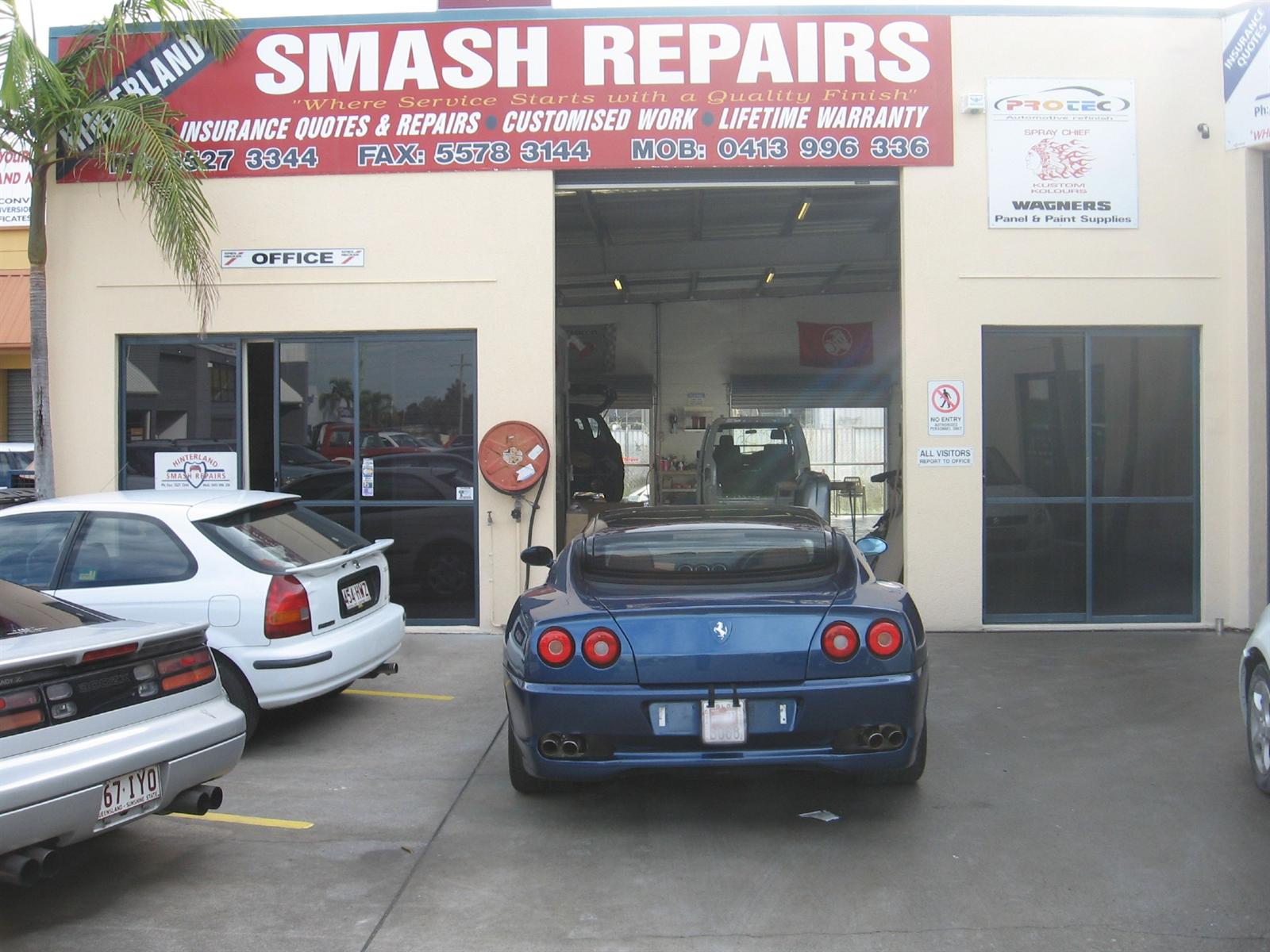 Hinterland Smash Repairs workshop frontage on Lawrence Drive, Nerang