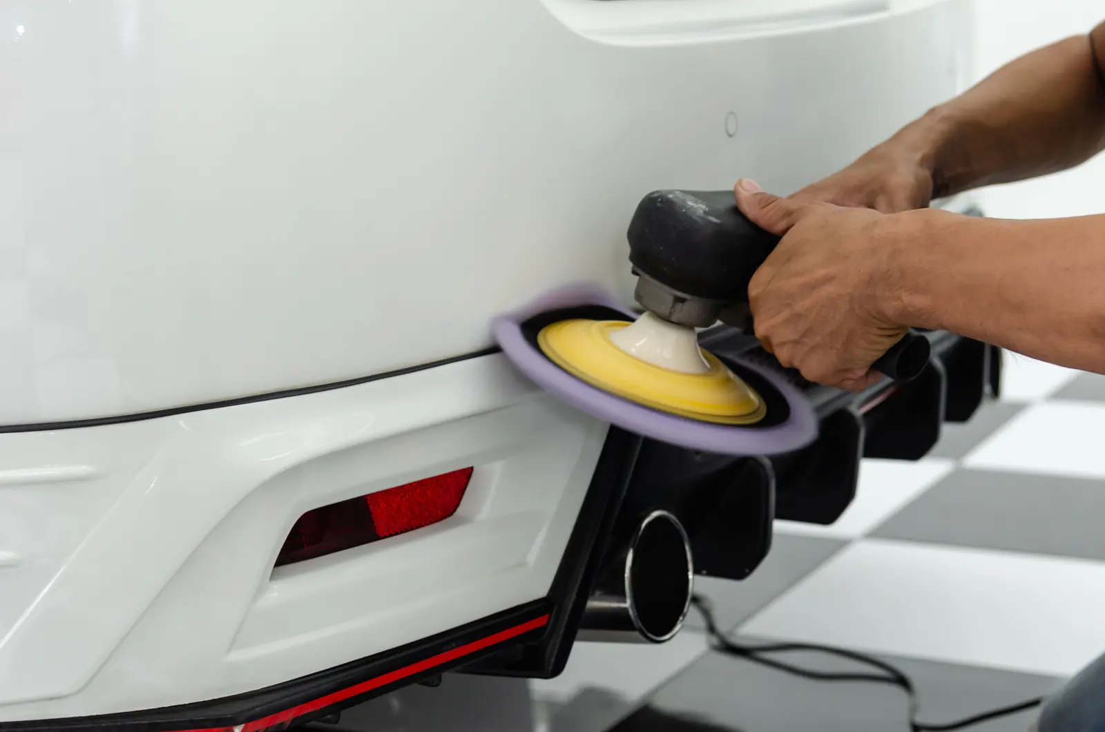 Polishing a white bumper to a gloss finish